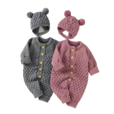 Knitted rompers with bear ear hats in pink and grey, featuring pom-pom design and front button closure for babies aged 0-24 months.