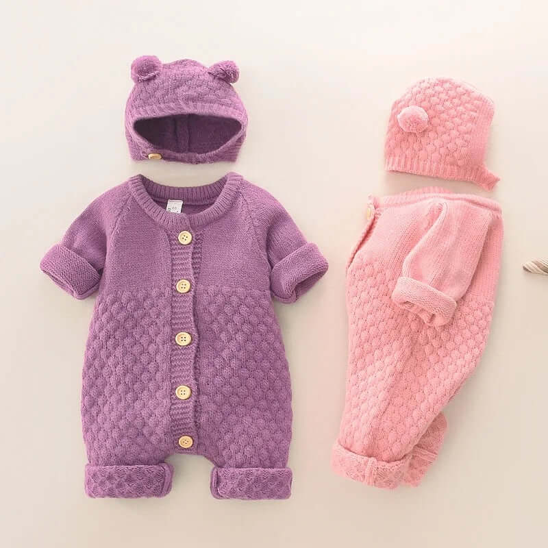 Knitted rompers with bear ear hats in purple and pink, featuring button closure and pom-pom details, perfect for babies 0-24 months.