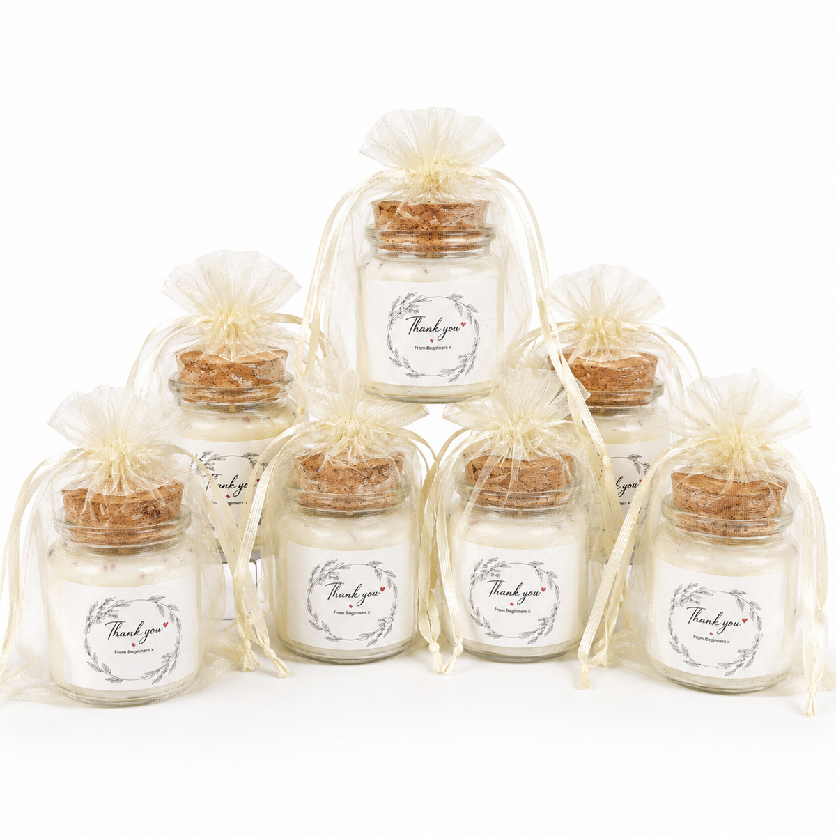 Mini soy wax candle favours arranged for a party