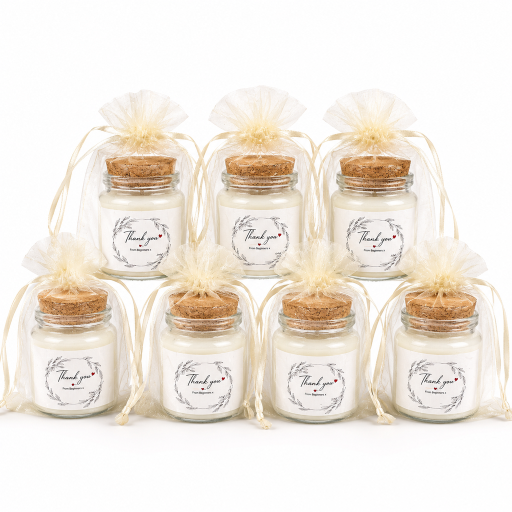 Personalised mini candles presented as guest favours